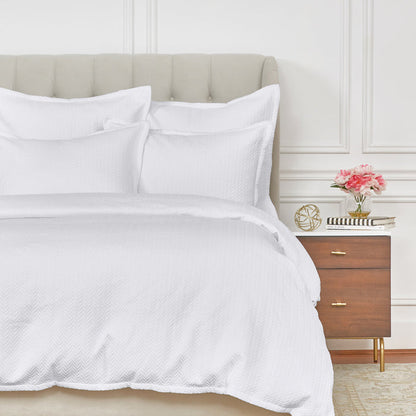 A Edin Duvet Cover displayed on a bed.