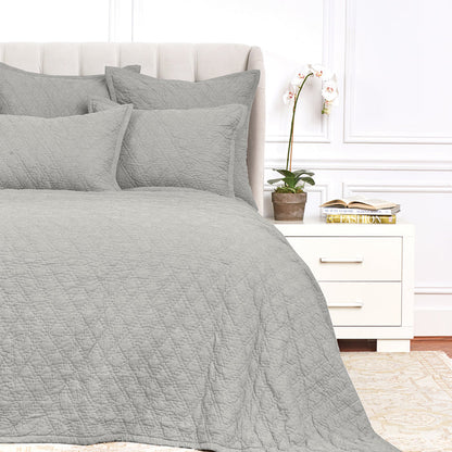 A Emory Quilt displayed on a made bed.