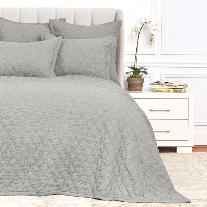 A Emory Quilt displayed on a made bed.