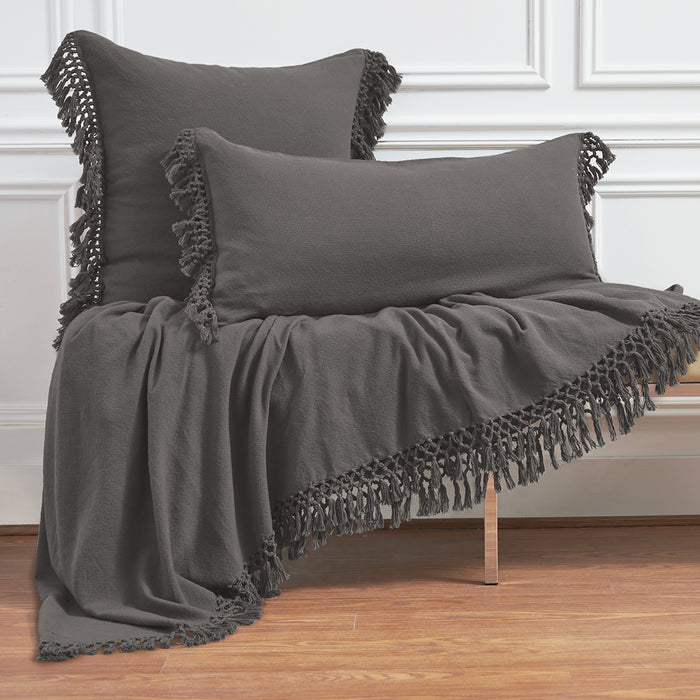 A Lavato Bed Throw displayed on a bed.
