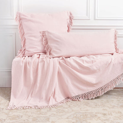 A Lavato Bed Throw displayed on a bed.