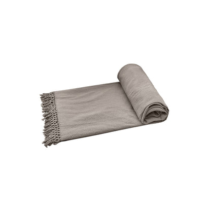 A Lavato Bed Throw displayed on a bed.