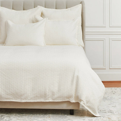 A Pernille Duvet Cover displayed on a bed.