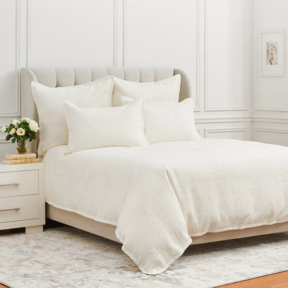 A Pernille Duvet Cover displayed on a bed.