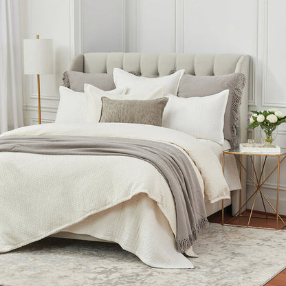 A Pernille Duvet Cover displayed on a bed.