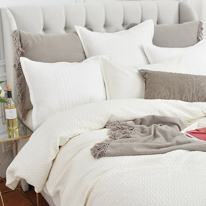 A Pernille Duvet Cover displayed on a bed.