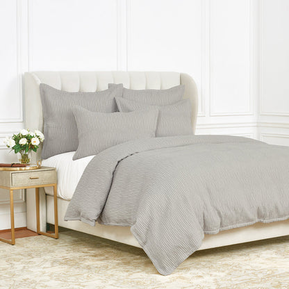 A Simone Duvet Cover displayed on a bed.