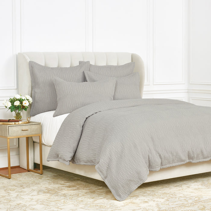 A Simone Duvet Cover displayed on a bed.