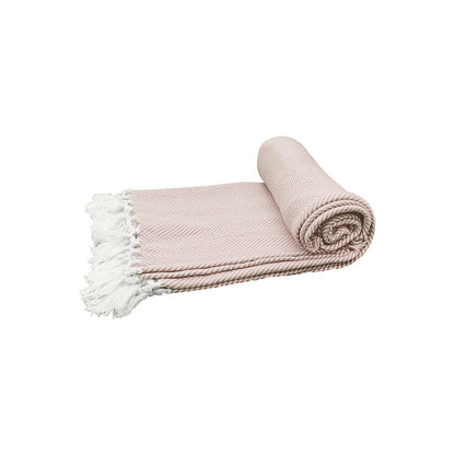 A rolled up pink beige throw blanket with a herringbone pattern and white fringes on a light background.